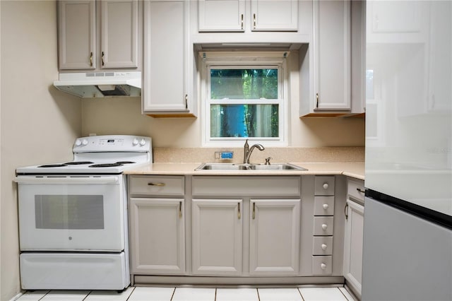 1630 Lakeview Ct, Eustis, FL 32726 - kitchen with white appliances, under cabinet range hood, light countertops, and light tile patterned flooring