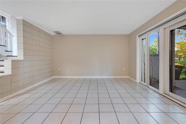 1630 Lakeview Ct, Eustis, FL 32726 - spare room with stairs and light tile patterned flooring
