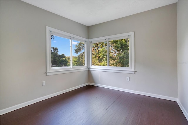 1630 Lakeview Ct, Eustis, FL 32726 - unfurnished room with baseboards and dark wood-style floors