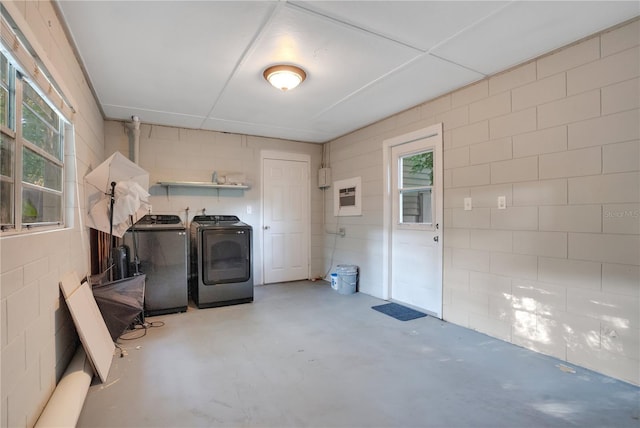 1630 Lakeview Ct, Eustis, FL 32726 - laundry area with separate washer and dryer and concrete block wall