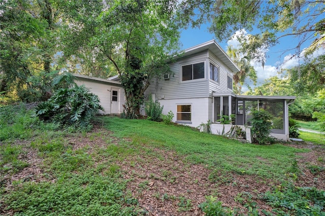 1630 Lakeview Ct, Eustis, FL 32726 - back of house featuring a sunroom and a lawn