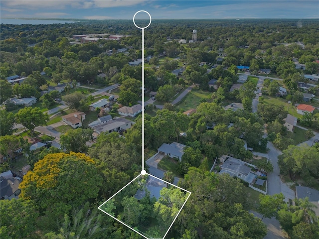 1630 Lakeview Ct, Eustis, FL 32726 - aerial perspective of suburban area featuring property parcel outlined and a heavily wooded area