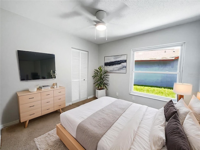 10344 Rosemount Dr, Tampa, FL 33624 - bedroom featuring ceiling fan, light carpet, and a closet