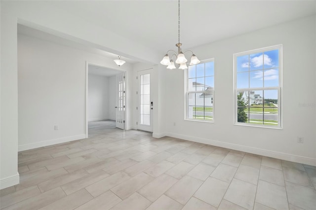5204 Obsidian Gate Dr, Mount Dora, FL 32757 - spare room featuring a chandelier and baseboards