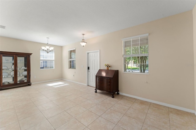 14897 Evergreen Oak Loop, Winter Garden, FL 34787 - unfurnished room featuring a chandelier and light tile patterned floors