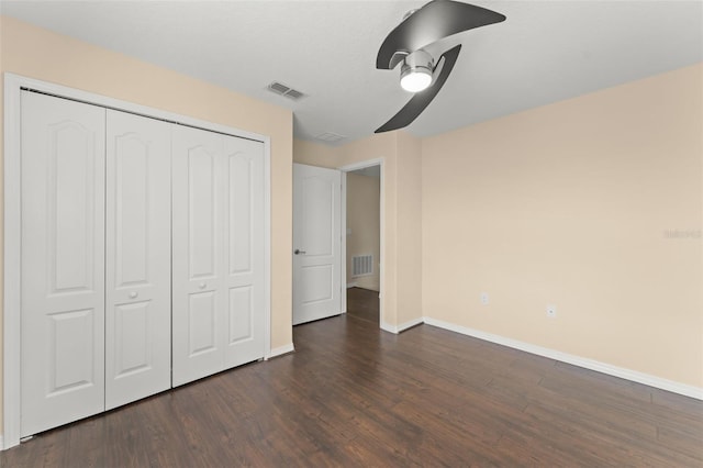 14897 Evergreen Oak Loop, Winter Garden, FL 34787 - unfurnished bedroom featuring dark wood-type flooring, a closet, and a ceiling fan