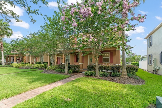 14897 Evergreen Oak Loop, Winter Garden, FL 34787 - view of front of home featuring a front yard and stucco siding