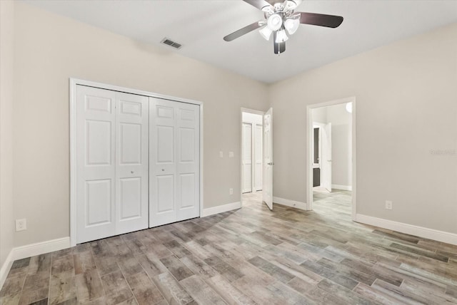 917 Southern Oak Ln, Apopka, FL 32712 - unfurnished bedroom with wood finished floors, a closet, and ceiling fan
