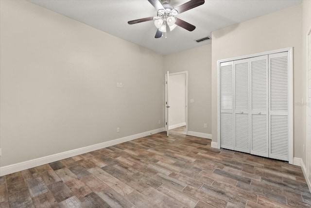 917 Southern Oak Ln, Apopka, FL 32712 - unfurnished bedroom featuring wood finished floors, a closet, and ceiling fan