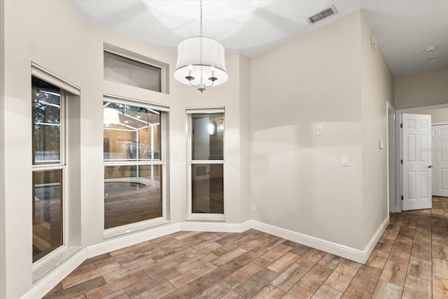 917 Southern Oak Ln, Apopka, FL 32712 - unfurnished room featuring wood finished floors and a chandelier