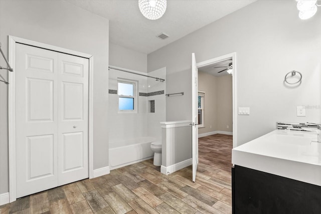 917 Southern Oak Ln, Apopka, FL 32712 - full bathroom featuring bathtub / shower combination, wood finished floors, a ceiling fan, and vanity