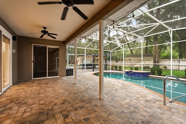 917 Southern Oak Ln, Apopka, FL 32712 - view of swimming pool with a jacuzzi, a patio, a fenced backyard, a ceiling fan, and glass enclosure