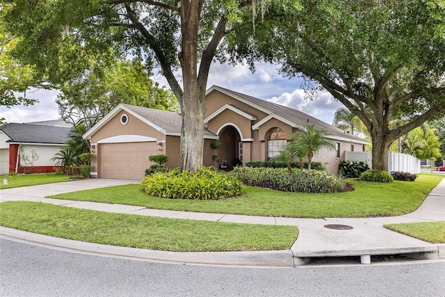 2737 Cahill Way, Lake Mary, FL 32746 - ranch-style house featuring stucco siding, a garage, a front lawn, and concrete driveway