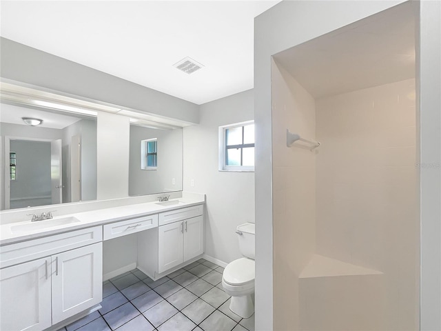 6740 Odoniel Loop W, Lakeland, FL 33809 - full bath with double vanity, tile patterned floors, and a shower