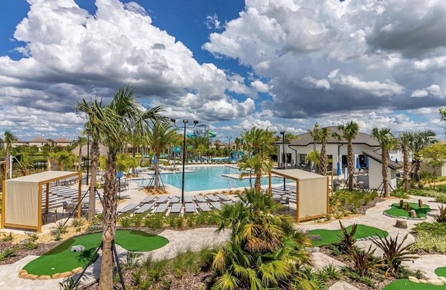 1452 Moon Valley Dr, Davenport, FL 33896 - community pool with a putting area and a patio area