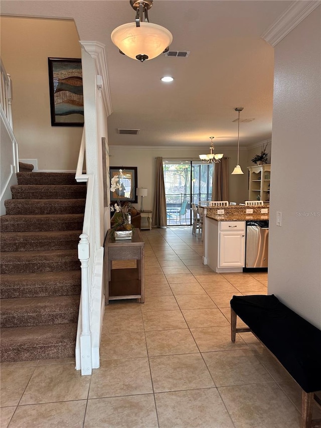 1452 Moon Valley Dr, Davenport, FL 33896 - stairs featuring ornamental molding, tile patterned flooring, and a chandelier