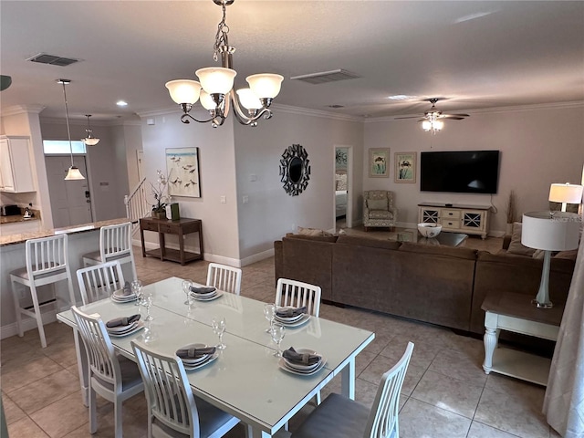 1452 Moon Valley Dr, Davenport, FL 33896 - dining area with light tile patterned flooring, crown molding, ceiling fan, and a chandelier