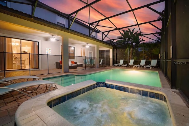 1452 Moon Valley Dr, Davenport, FL 33896 - view of pool featuring a patio area, a ceiling fan, a pool with connected hot tub, and a lanai