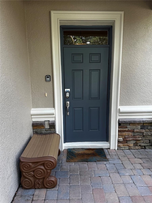 1452 Moon Valley Dr, Davenport, FL 33896 - doorway to property with stucco siding