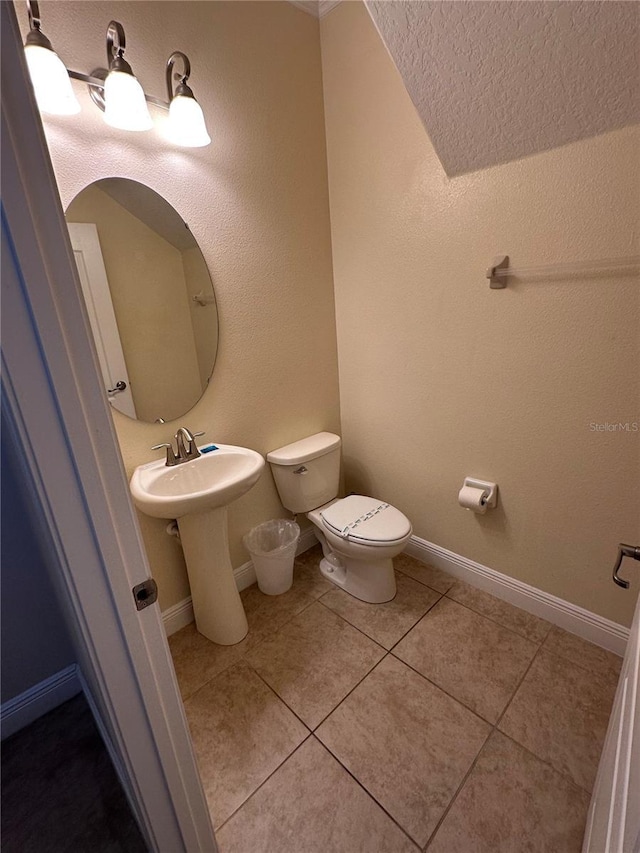 1452 Moon Valley Dr, Davenport, FL 33896 - half bathroom featuring toilet and tile patterned floors