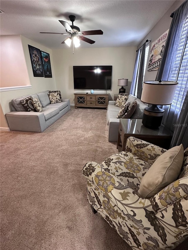 1452 Moon Valley Dr, Davenport, FL 33896 - living area with carpet, a ceiling fan, and a textured ceiling