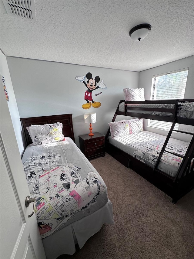 1452 Moon Valley Dr, Davenport, FL 33896 - carpeted bedroom featuring a textured ceiling
