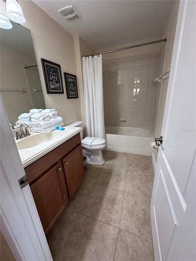 1452 Moon Valley Dr, Davenport, FL 33896 - full bathroom with vanity, shower / bath combination with curtain, tile patterned floors, and a textured ceiling