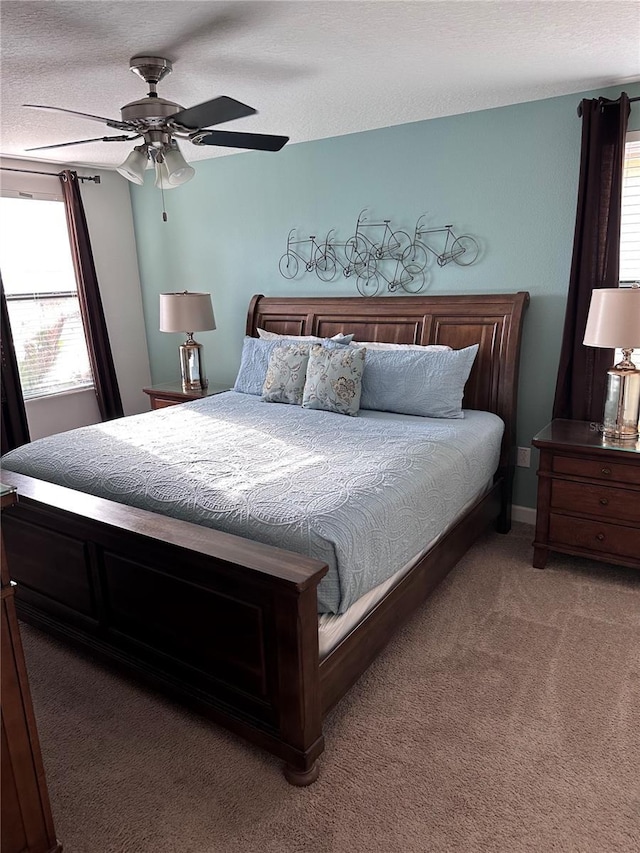 1452 Moon Valley Dr, Davenport, FL 33896 - bedroom with carpet, a textured ceiling, and ceiling fan