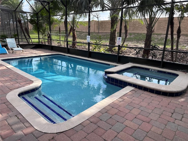 1452 Moon Valley Dr, Davenport, FL 33896 - view of swimming pool featuring a lanai, a patio, and a pool with connected hot tub