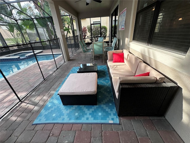 1452 Moon Valley Dr, Davenport, FL 33896 - sunroom / solarium with ceiling fan, a hot tub, and an outdoor hangout area