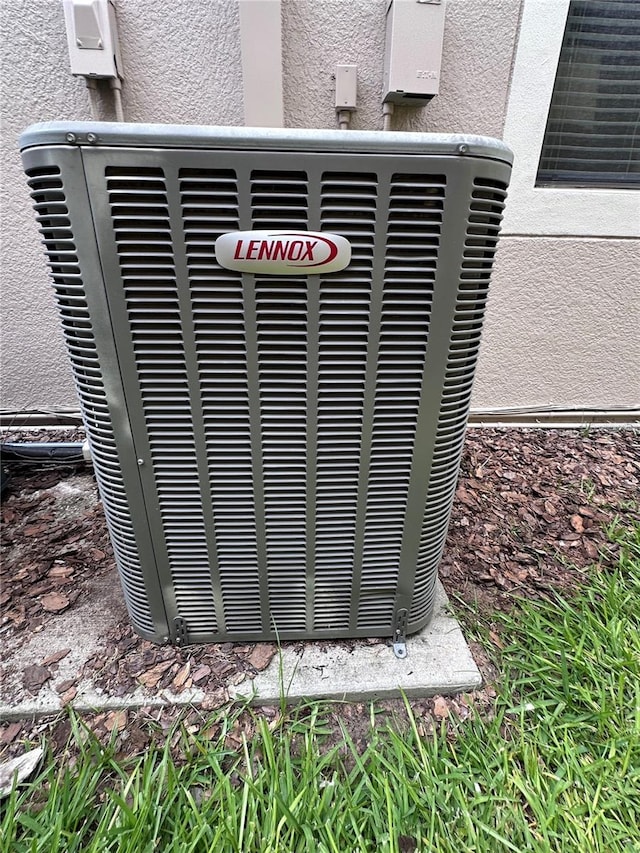 1452 Moon Valley Dr, Davenport, FL 33896 - exterior view of a cooling unit and stucco siding