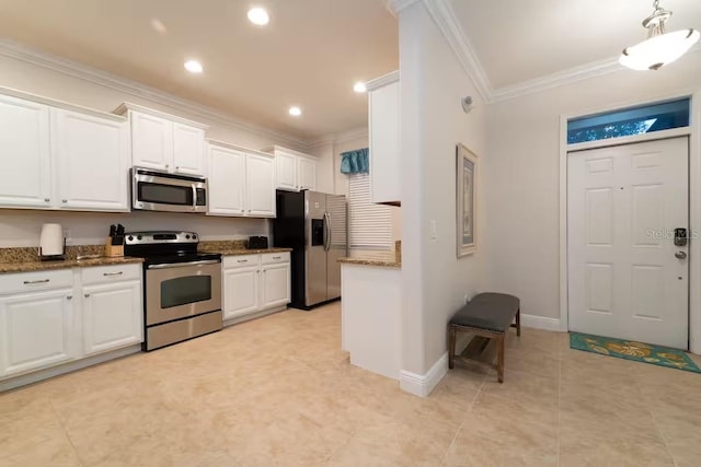 1452 Moon Valley Dr, Davenport, FL 33896 - kitchen with stainless steel appliances, ornamental molding, white cabinets, dark stone countertops, and light tile patterned floors