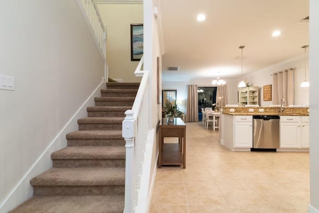 1452 Moon Valley Dr, Davenport, FL 33896 - stairs featuring a chandelier, tile patterned floors, recessed lighting, and crown molding