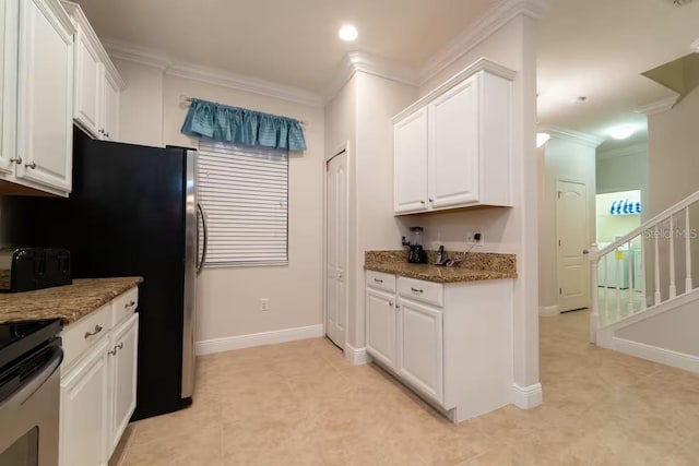 1452 Moon Valley Dr, Davenport, FL 33896 - kitchen with crown molding, white cabinetry, dark stone counters, and recessed lighting