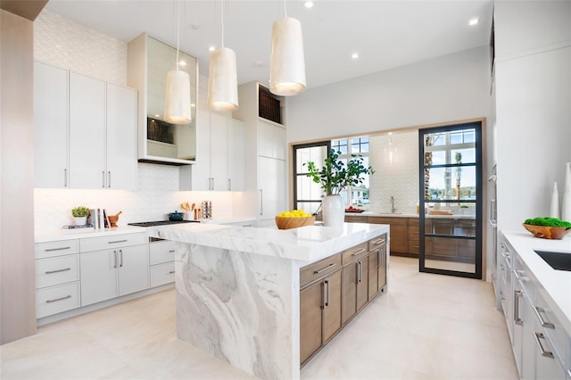 4007 Grande Brick Loop Unit 13, Orlando, FL 32837 - kitchen featuring a center island, decorative backsplash, modern cabinets, and recessed lighting