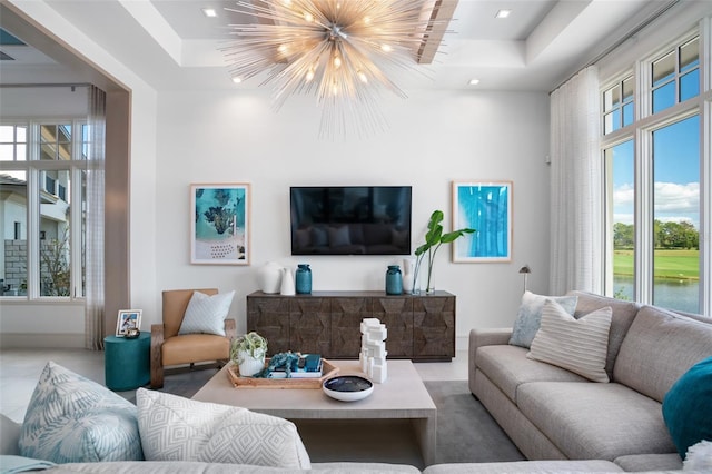 4007 Grande Brick Loop Unit 13, Orlando, FL 32837 - living area with a tray ceiling, a chandelier, plenty of natural light, recessed lighting, and a high ceiling