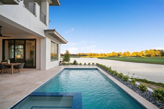 4007 Grande Brick Loop Unit 13, Orlando, FL 32837 - view of swimming pool with a pool with connected hot tub, a patio, and a water view