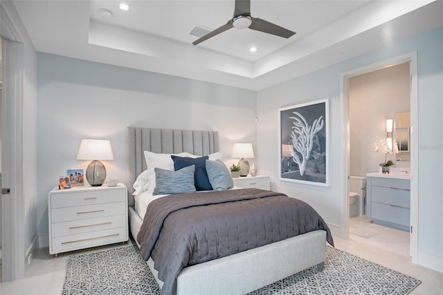 4007 Grande Brick Loop Unit 13, Orlando, FL 32837 - bedroom featuring a tray ceiling, ensuite bathroom, recessed lighting, and ceiling fan