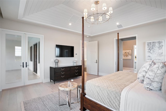 4007 Grande Brick Loop Unit 13, Orlando, FL 32837 - bedroom featuring a chandelier, french doors, light wood finished floors, a raised ceiling, and recessed lighting