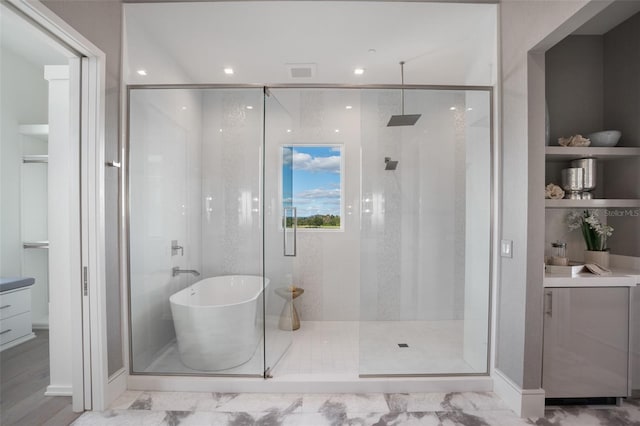 4007 Grande Brick Loop Unit 13, Orlando, FL 32837 - bathroom with a stall shower, vanity, and a freestanding tub