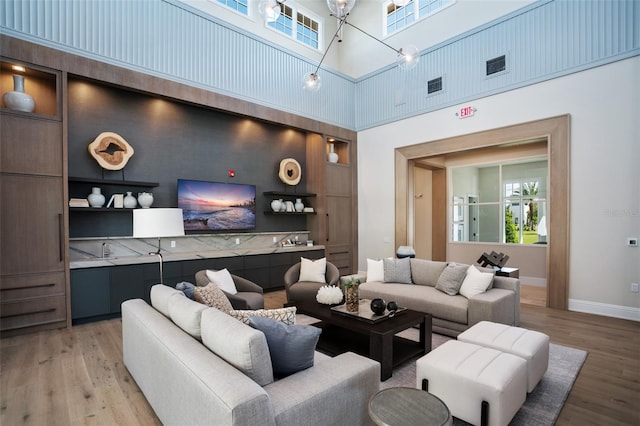 4007 Grande Brick Loop Unit 13, Orlando, FL 32837 - living area with light wood-type flooring and a high ceiling