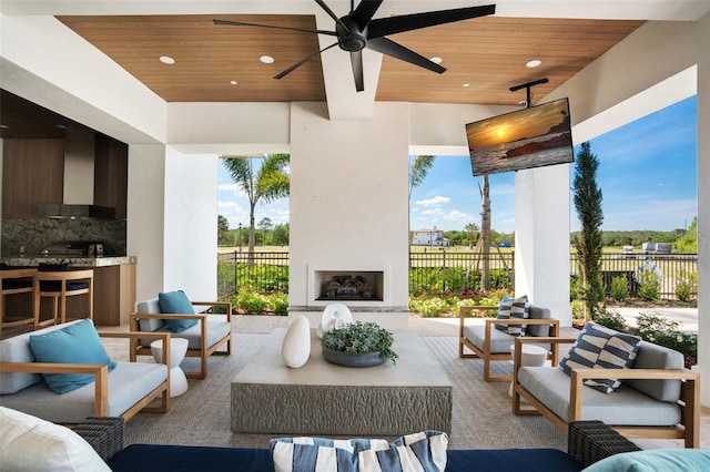 4007 Grande Brick Loop Unit 13, Orlando, FL 32837 - view of patio / terrace featuring an outdoor living space with a fireplace and ceiling fan