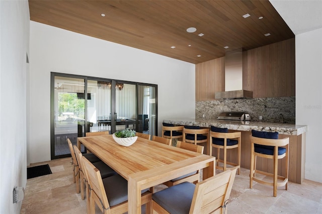 4007 Grande Brick Loop Unit 13, Orlando, FL 32837 - dining space featuring wood ceiling, light stone finish floors, and recessed lighting