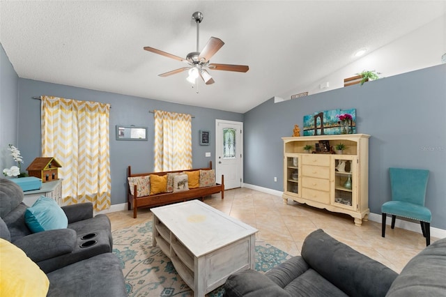 2042 Hayfield Way, Apopka, FL 32712 - living area with a ceiling fan, vaulted ceiling, light tile patterned floors, and a textured ceiling