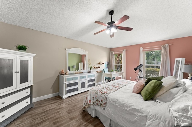 2042 Hayfield Way, Apopka, FL 32712 - bedroom featuring a textured ceiling, wood finished floors, and a ceiling fan