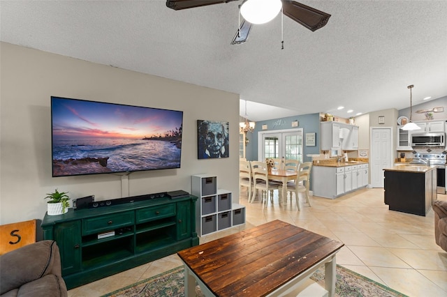 2042 Hayfield Way, Apopka, FL 32712 - living area with light tile patterned floors, a ceiling fan, a chandelier, a textured ceiling, and recessed lighting