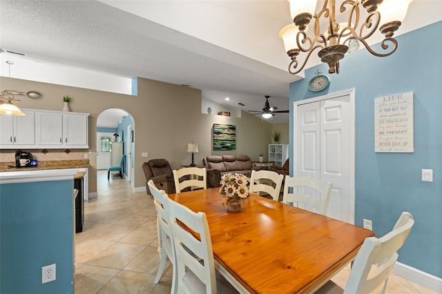 2042 Hayfield Way, Apopka, FL 32712 - dining space featuring arched walkways, light tile patterned flooring, ceiling fan, a chandelier, and lofted ceiling
