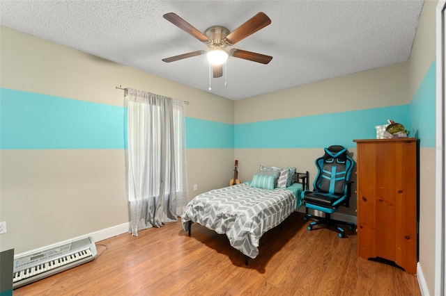 2042 Hayfield Way, Apopka, FL 32712 - bedroom with wood finished floors, a textured ceiling, and a ceiling fan