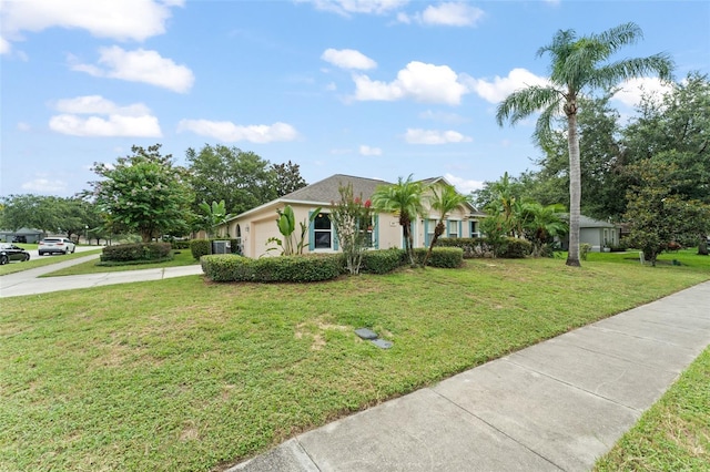 2042 Hayfield Way, Apopka, FL 32712 - view of front facade featuring an attached garage, concrete driveway, a front yard, and stucco siding