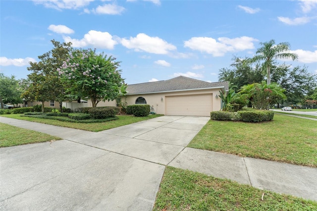 2042 Hayfield Way, Apopka, FL 32712 - view of front of property featuring driveway, a garage, a front yard, and stucco siding